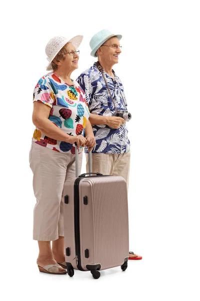 Senior tourists with a suitcase waiting in line — Stock Photo, Image