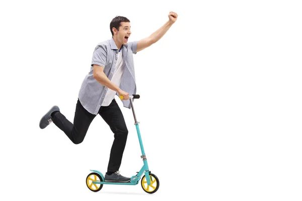 Happy guy riding a scooter — Stock Photo, Image