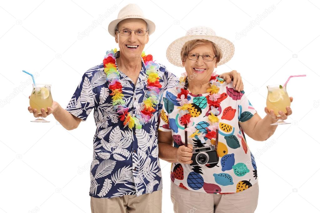 Elderly tourists with cocktails