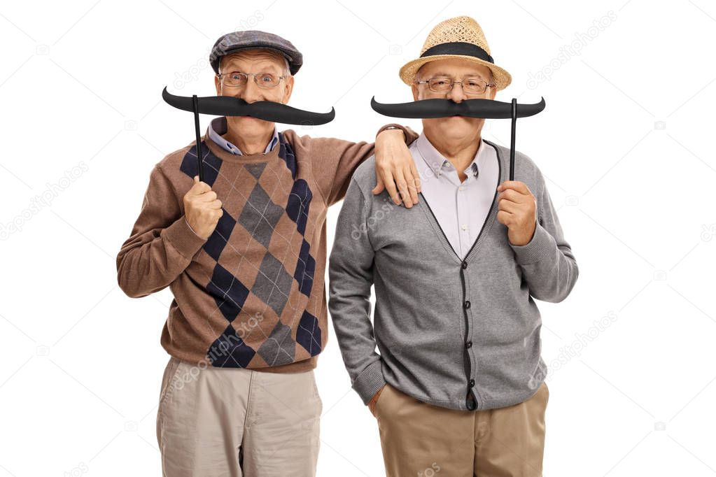 Seniors posing with big fake moustaches