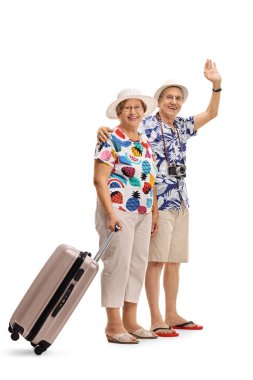 bavul ve erkek turist sallayarak kadın turist