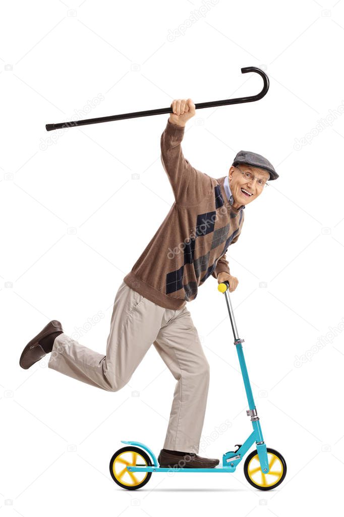 Cheerful senior riding a scooter with walking cane