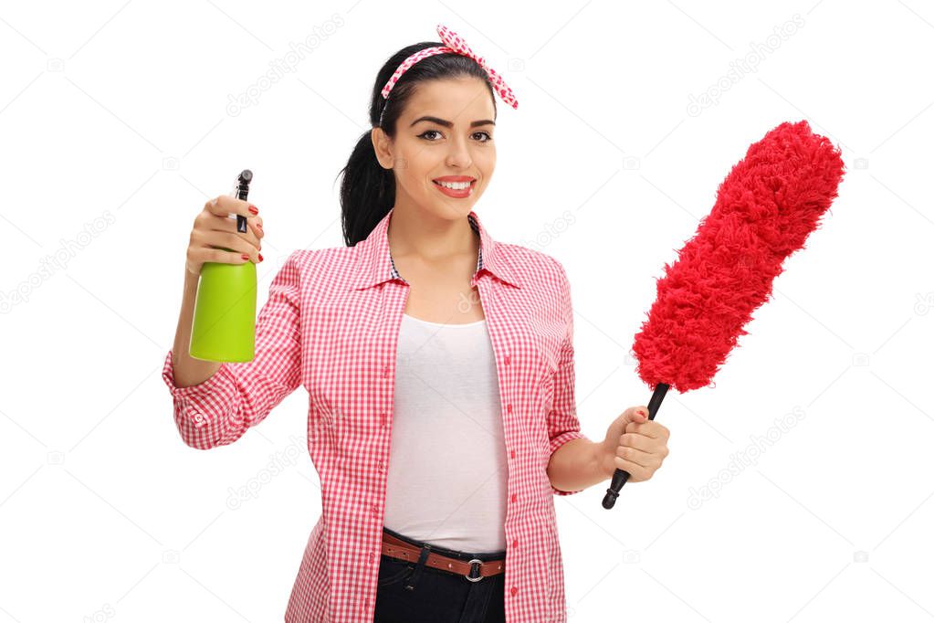Woman holding a duster and a spray