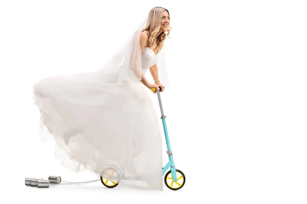 Newlywed bride riding a scooter — Stock Photo, Image