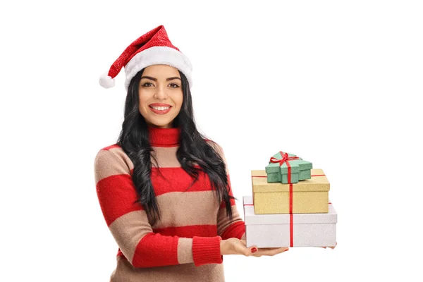 Woman wearing a christmas hat and holding a presents — Stock Photo, Image