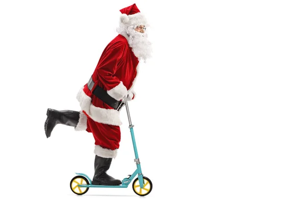 Papai Noel montando uma scooter — Fotografia de Stock