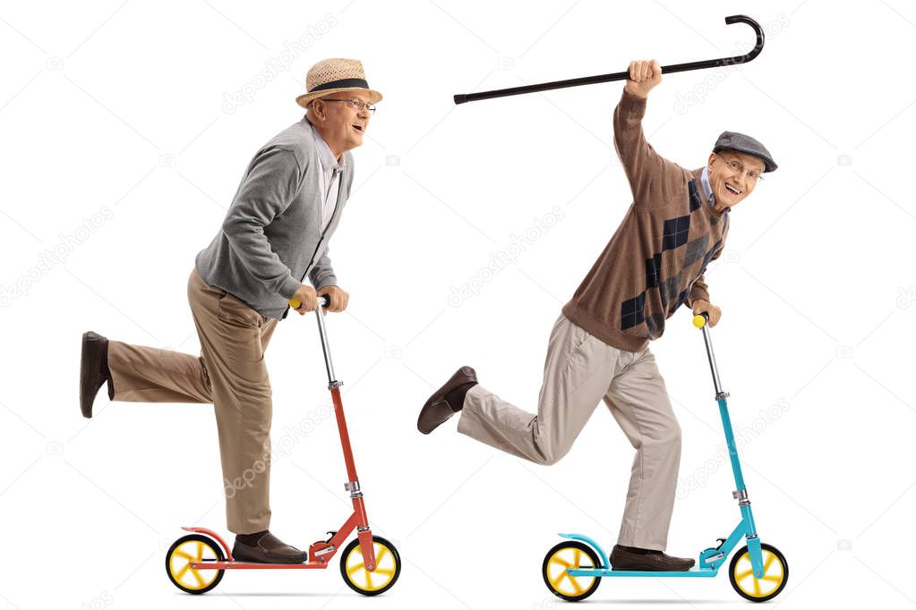 Two overjoyed seniors riding scooters