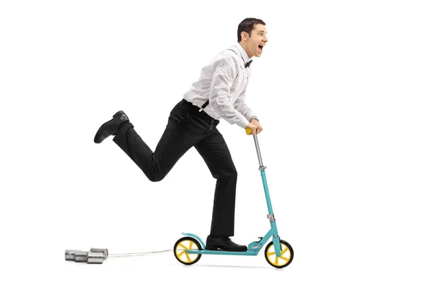 Newlywed groom riding a scooter — Stock Photo, Image