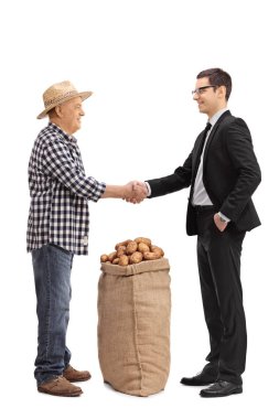 Çiftçi ile bir işadamı ile el sallayarak bir çuvala