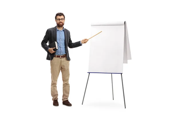 Teacher holding a book and pointing with a wand at a blank prese — Stock Photo, Image