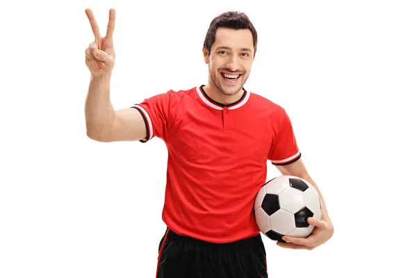 Delighted football player making a victory gesture — Stock Photo, Image