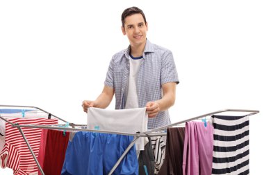 Young man hanging clothes clipart