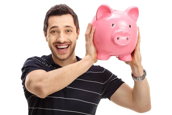 Glada mannen med en piggybank — Stockfoto
