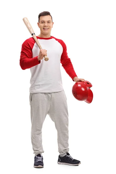 Jogador de beisebol segurando um taco e um capacete — Fotografia de Stock