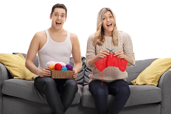 Overjoyed couple knitting together — Stock Photo, Image
