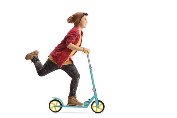 Niño feliz montando un scooter —  Fotos de Stock