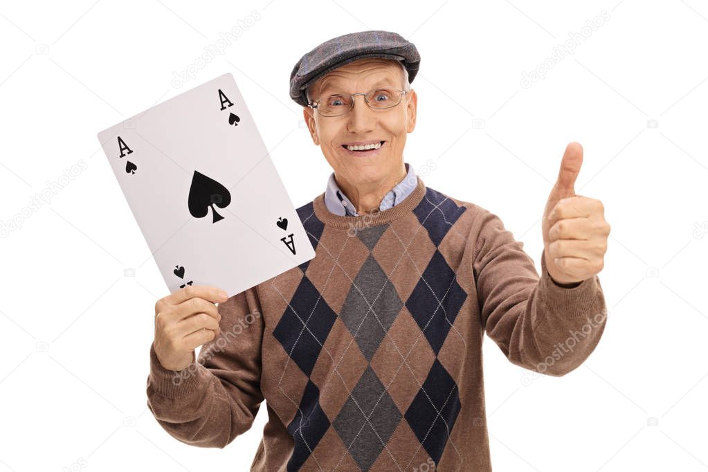 Senior holding ace of spades card and making thumb up sign