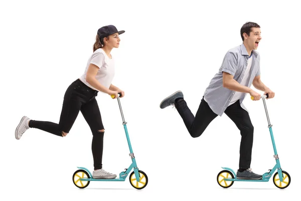 Girl and a guy riding scooters — Stock Photo, Image