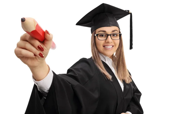 Estudiante graduada escribiendo con un lápiz — Foto de Stock