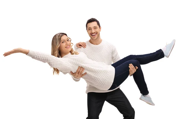 Happy man carrying a woman in his arms — Stock Photo, Image