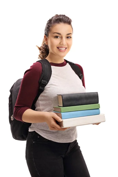 Studente donna che tiene una pila di libri — Foto Stock