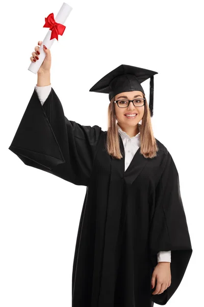 Joyful graduate student holding a diploma in the air — Stock Photo, Image