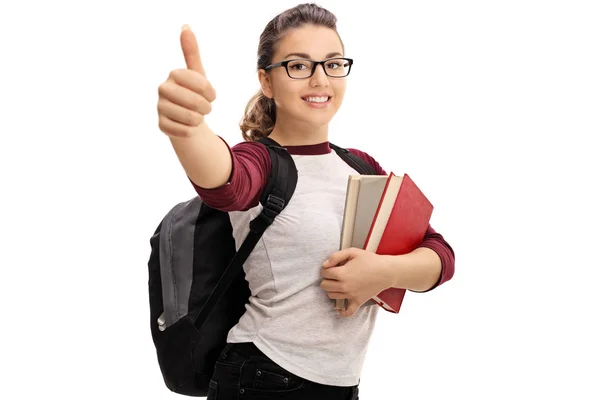 Mujer estudiante haciendo un pulgar hacia arriba signo —  Fotos de Stock