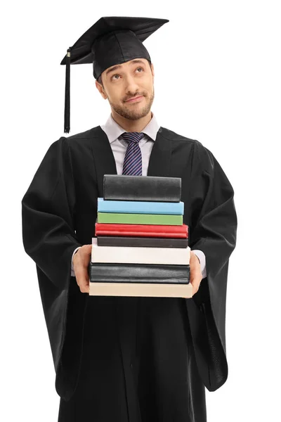 Estudante de pós-graduação pensivo segurando uma pilha de livros — Fotografia de Stock