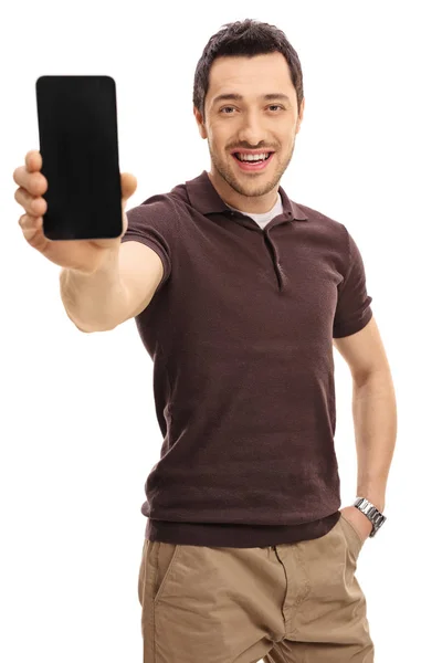 Ung man visar en telefon — Stockfoto