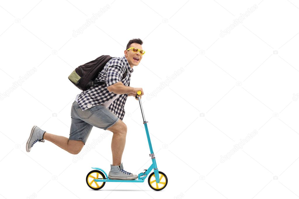 overjoyed guy riding a scooter