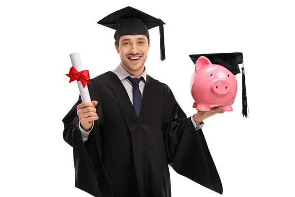 Estudiante graduado sosteniendo un diploma y una hucha — Foto de Stock