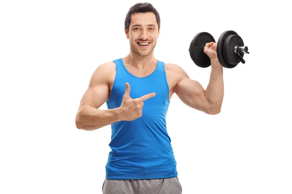 Hombre feliz levantando una mancuerna y señalando — Foto de Stock