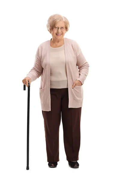 Donna anziana con un bastone da passeggio sorridente — Foto Stock