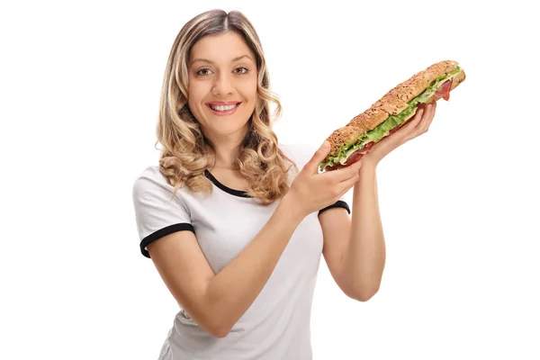 Jovem feliz com um sanduíche — Fotografia de Stock