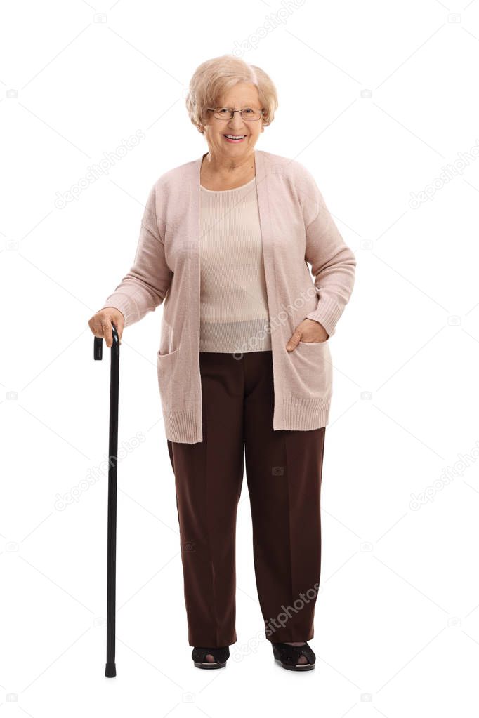 Elderly woman with a walking cane smiling