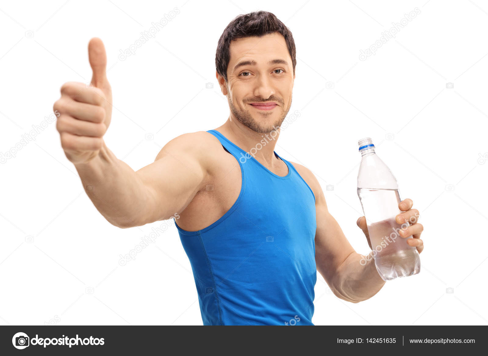 Guy holding bottle of water and making thumb up gesture Stock Photo by
