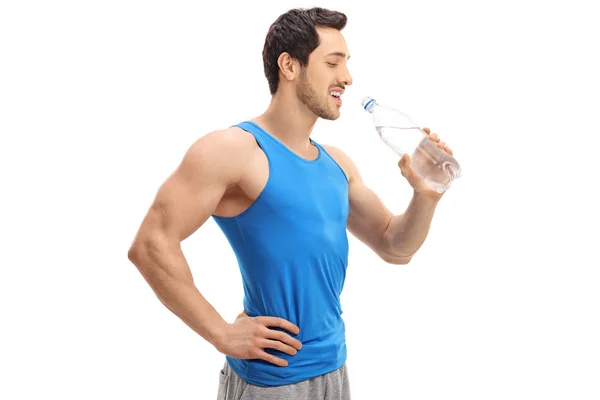 Sportsman drinking water from a bottle — Stock Photo, Image