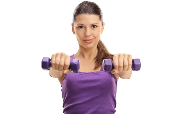 Young woman exercising with dumbbells — Stock Photo, Image