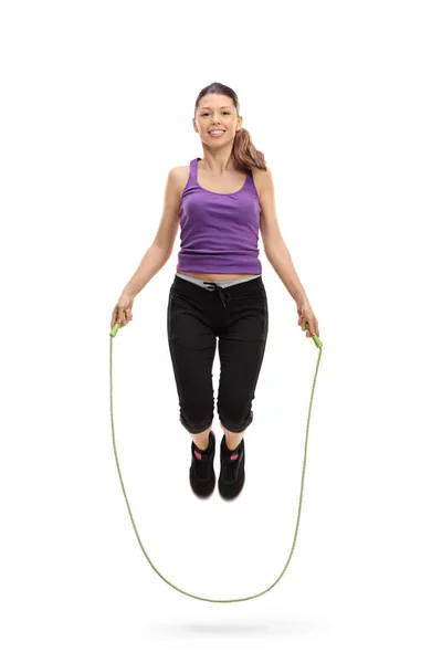 Female athlete exercising with a skipping rope — Stock Photo, Image