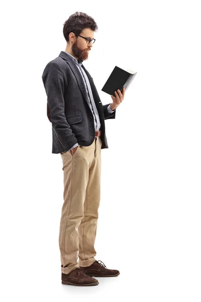 Male professor standing and reading a book — Stock Photo, Image