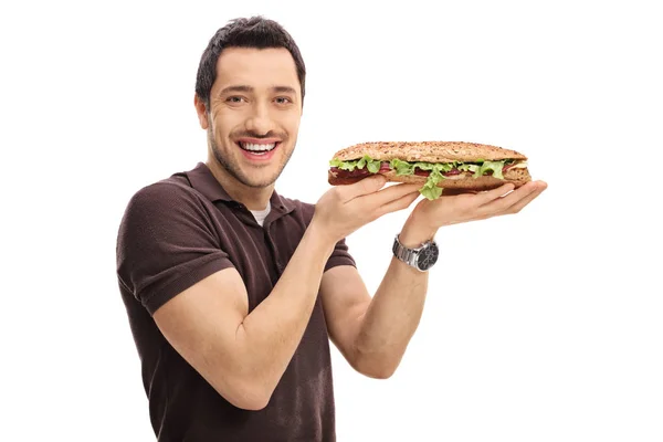 Felice ragazzo che tiene un panino — Foto Stock