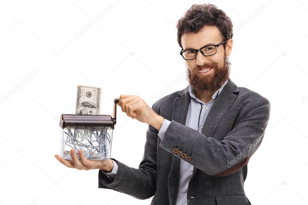 Man destroying a dollar banknote in a paper shredder