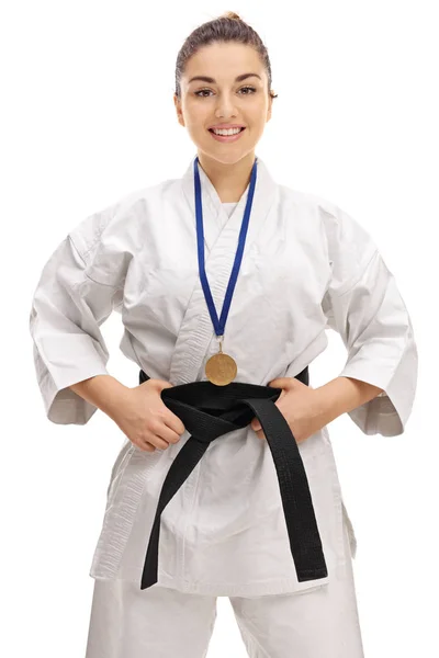 Karate girl with a gold medal smiling — Stock Photo, Image