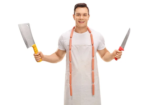 Young butcher with a cleaver and a knife — Stock Photo, Image