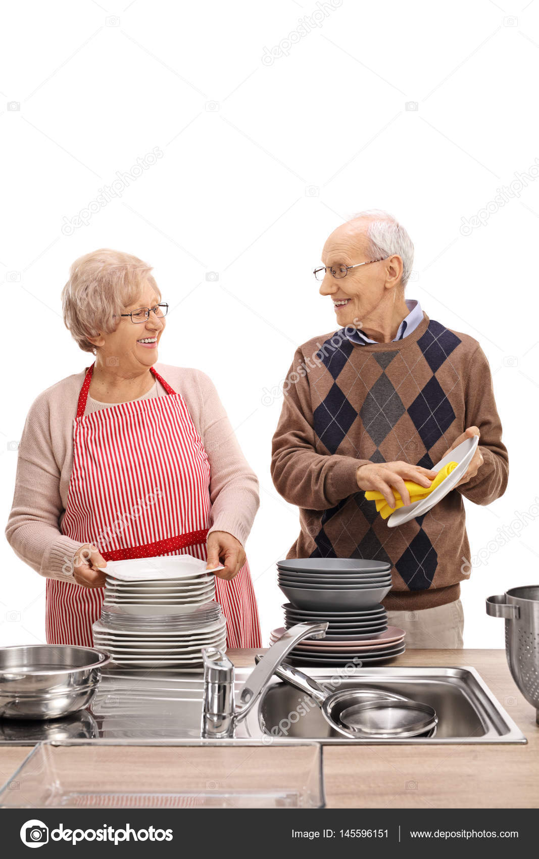Elderly couple washing the dishes together — Stock Photo © ljsphotography 145596151