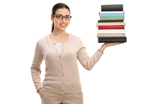Mladá žena učitel s hromadou knih — Stock fotografie