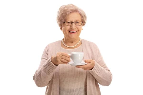 Cheerful elderly woman holding a cup — Stock Photo, Image