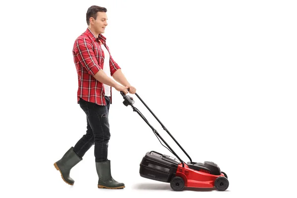 Gardener mowing with a lawnmower — Stock Photo, Image