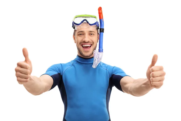 Guy in a wetsuit making a thumbs up gesture — Stock Photo, Image