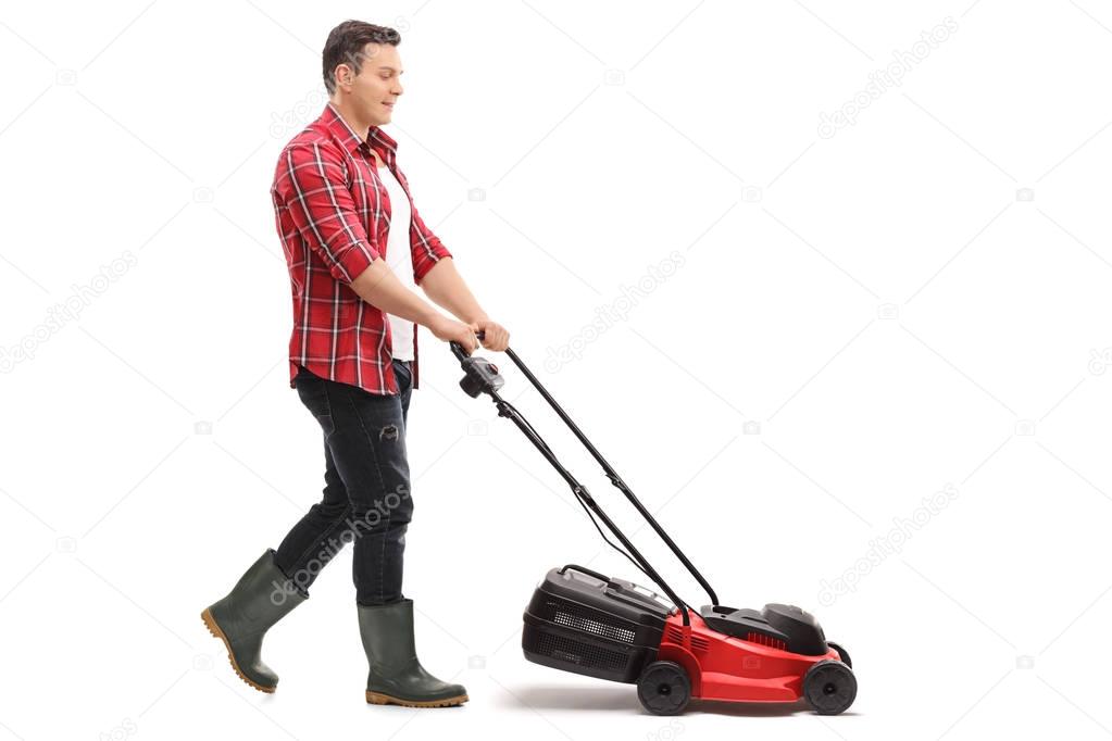 Gardener mowing with a lawnmower